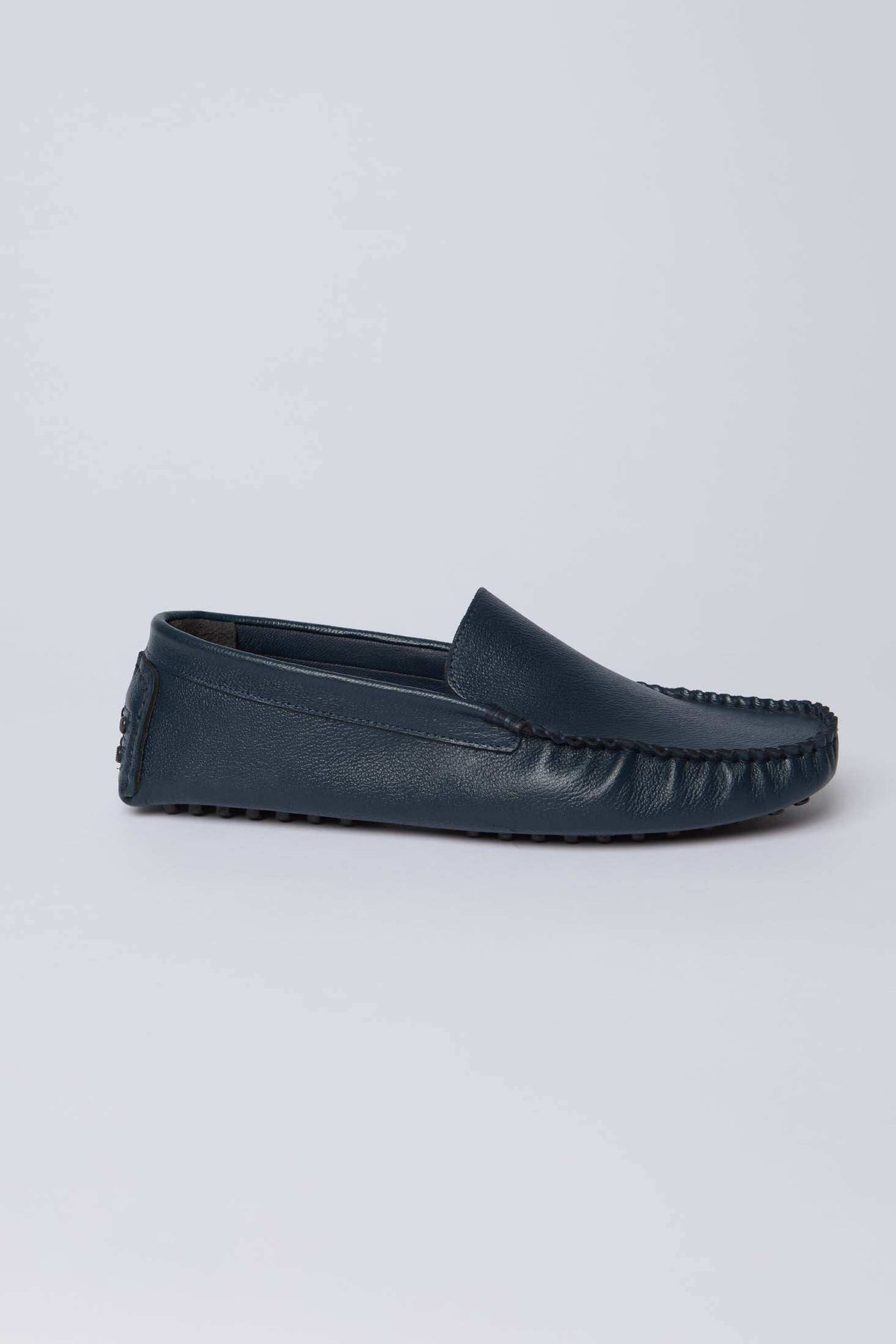 Dalydress men's navy blue leather loafer with moccasin stitching, side view on white background