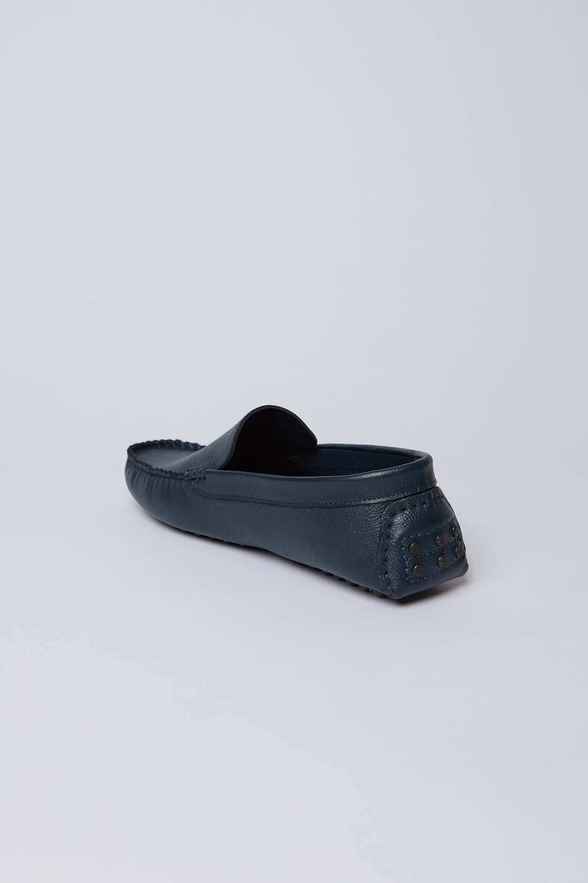 Dalydress men's navy leather loafer with rubber studded heel on white background