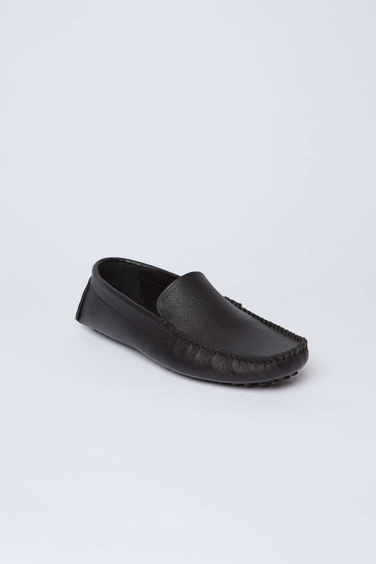 Dalydress black leather men's loafer shoe on white background, casual urban style
