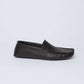 Dalydress men's black leather loafer with moccasin stitching, side view on white background