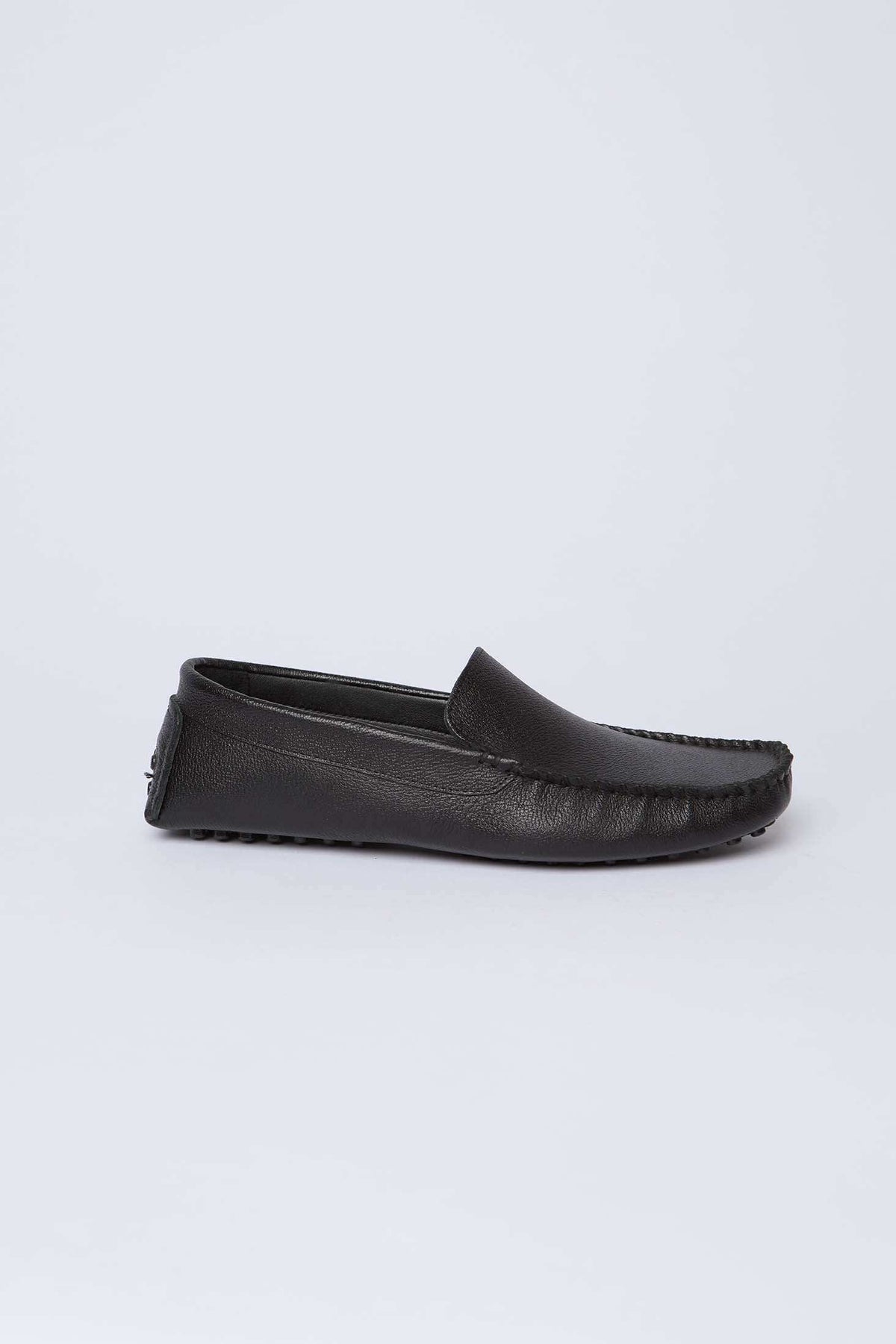 Dalydress men's black leather loafer with moccasin stitching, side view on white background