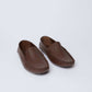 Dalydress men's brown leather loafers with stitched detailing on white background