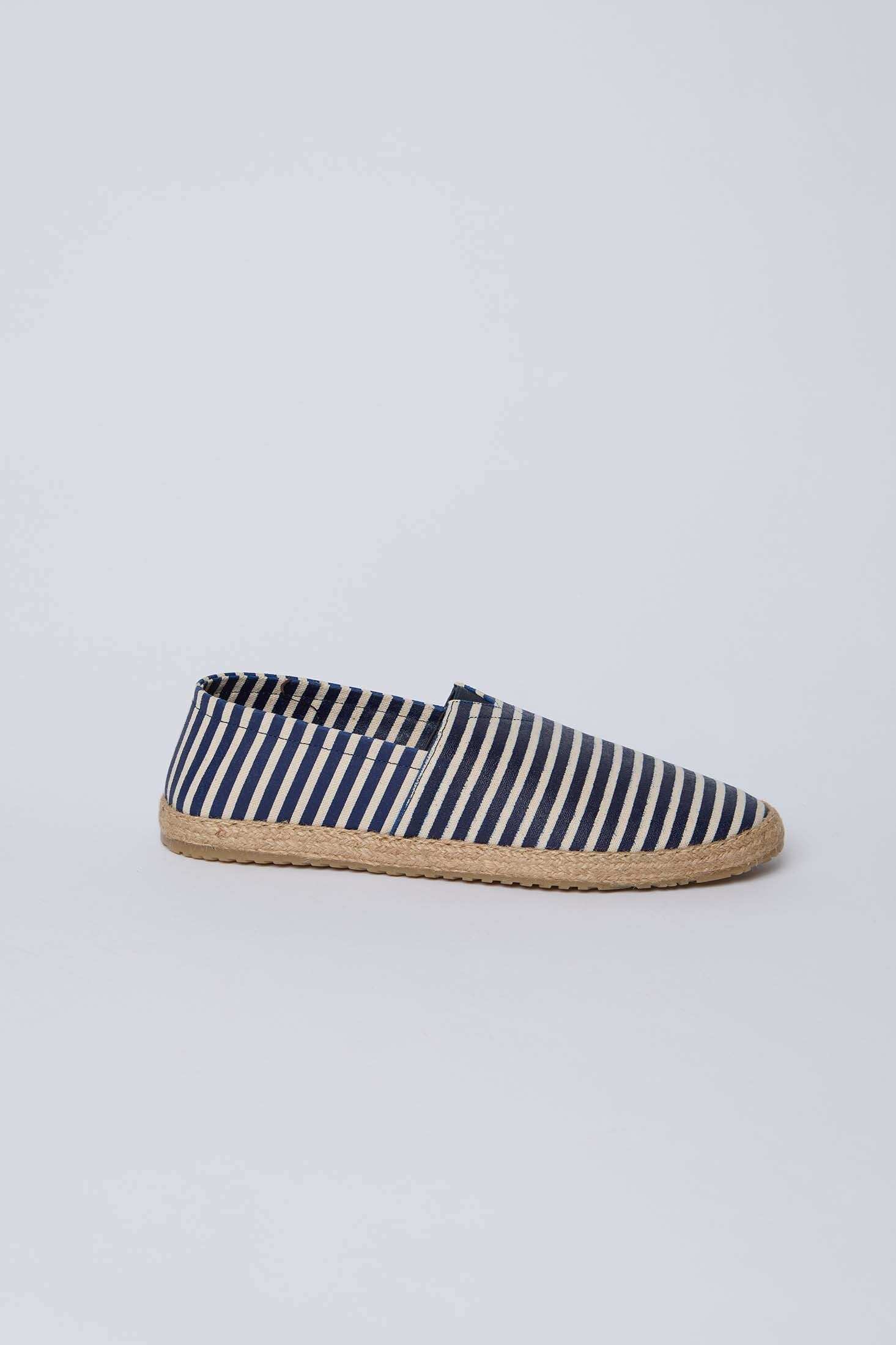Dalydress blue and white striped espadrille shoe with woven sole on white background