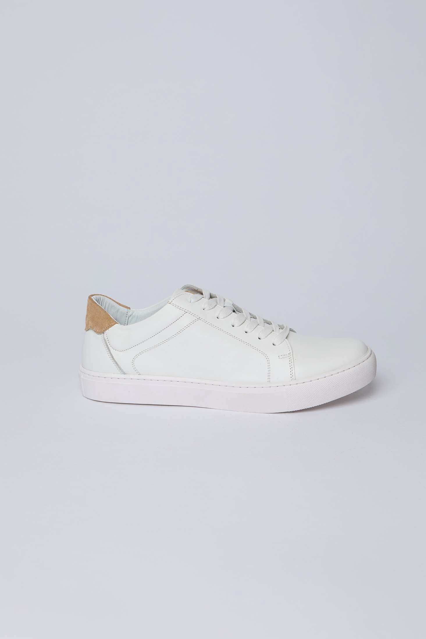 Dalydress white leather men's sneaker with tan suede heel accent on plain background