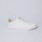 Dalydress white leather men's sneaker with tan suede heel accent on plain background