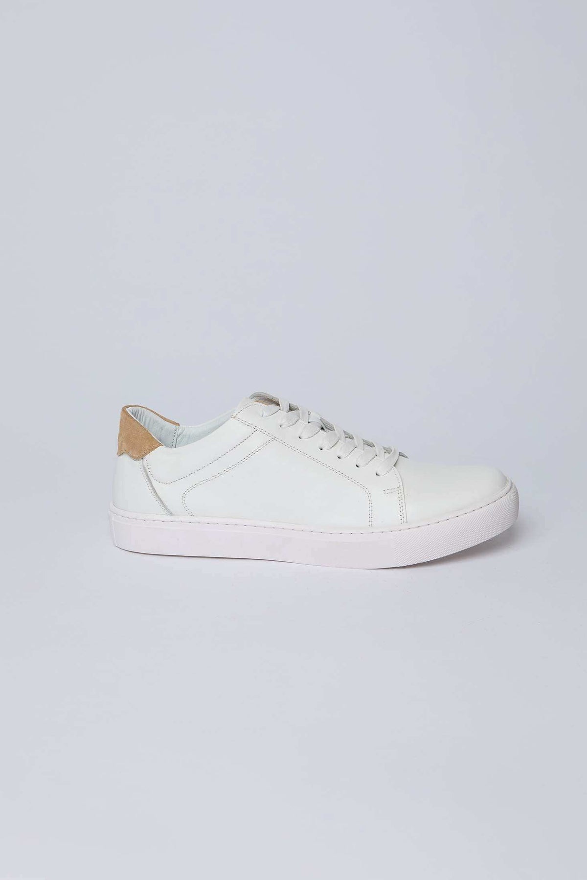 Dalydress white leather men's sneaker with tan suede heel accent on plain background