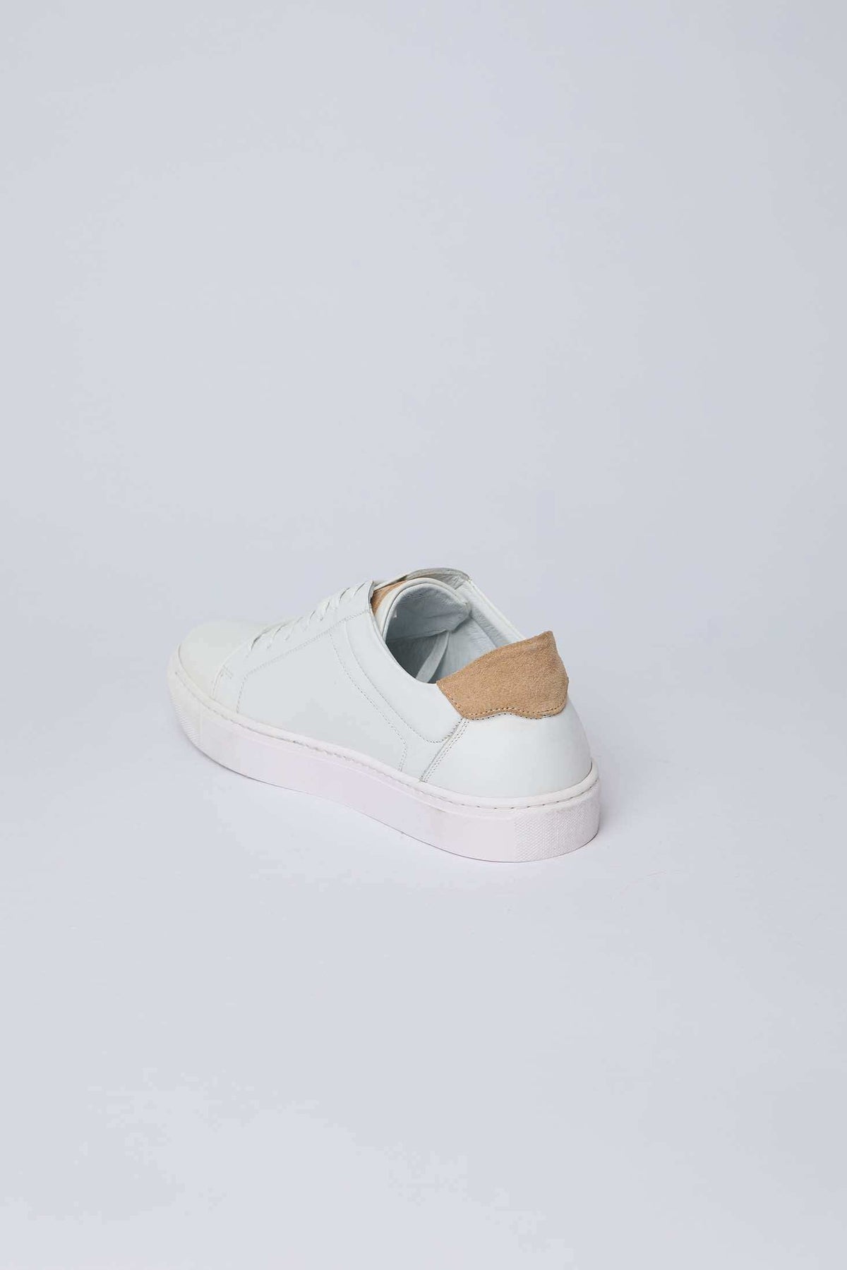Dalydress men's white sneaker with tan suede heel detail on white background