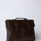 Dalydress brown leather briefcase with top handle and buckle closure, men's accessory