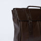 Dalydress brown leather men's briefcase with handle and buckle on a white background