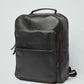 Dalydress men's black leather backpack with front pocket on white background