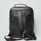 Dalydress black leather backpack with top handle, adjustable straps, and rear zipper pocket