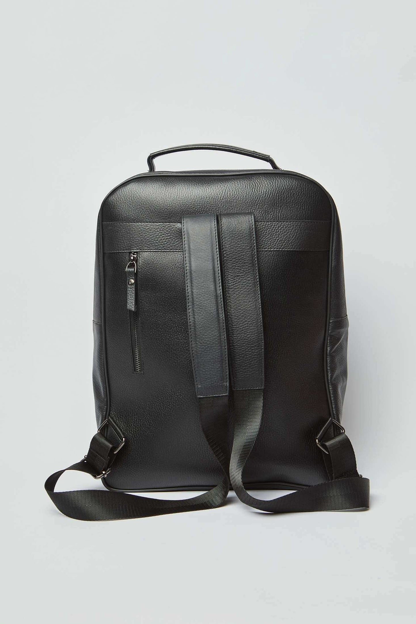 Dalydress black leather backpack with top handle, adjustable straps, and rear zipper pocket