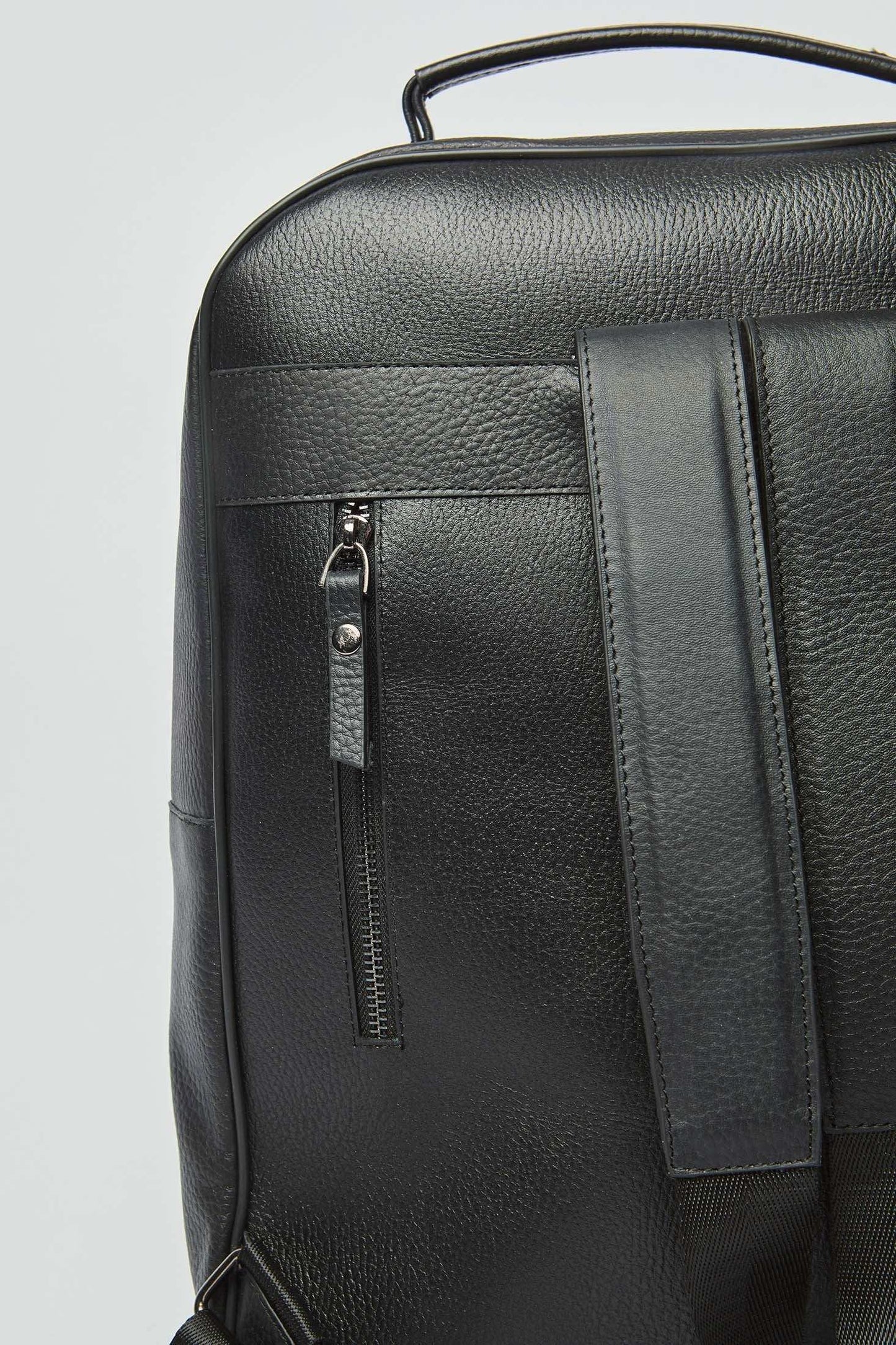 Dalydress textured black leather backpack with zippered pocket and top handle