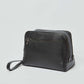 Dalydress black leather toiletry bag with wrist strap and front zipper pocket