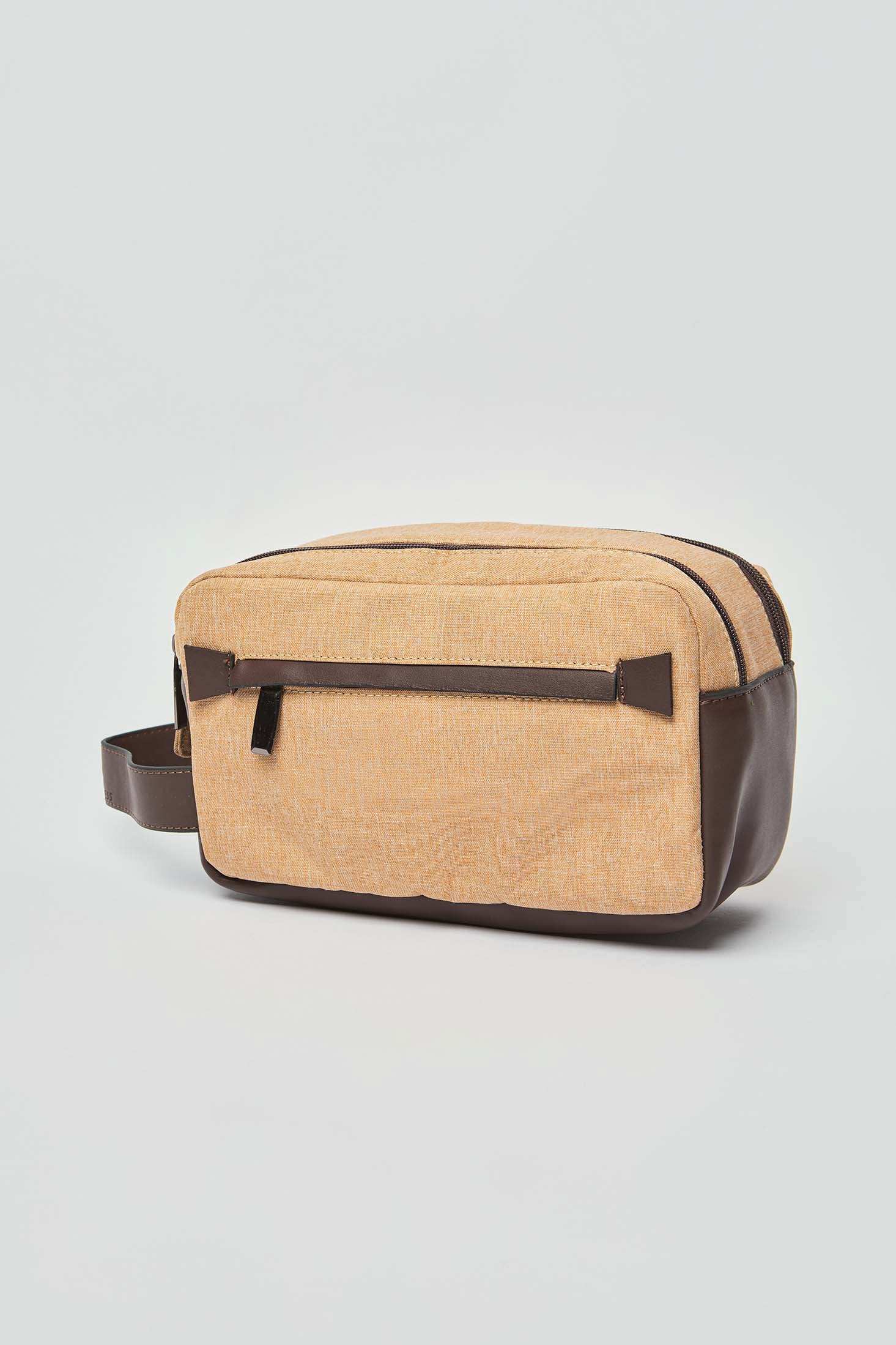 Dalydress tan and brown men's toiletry bag with front zipper pocket on white background