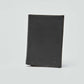 Dalydress black leather men's wallet with embossed logo on plain background