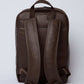 Dalydress brown leather backpack with padded straps, back view, on white background