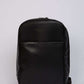 Dalydress black leather backpack with front pocket on white background