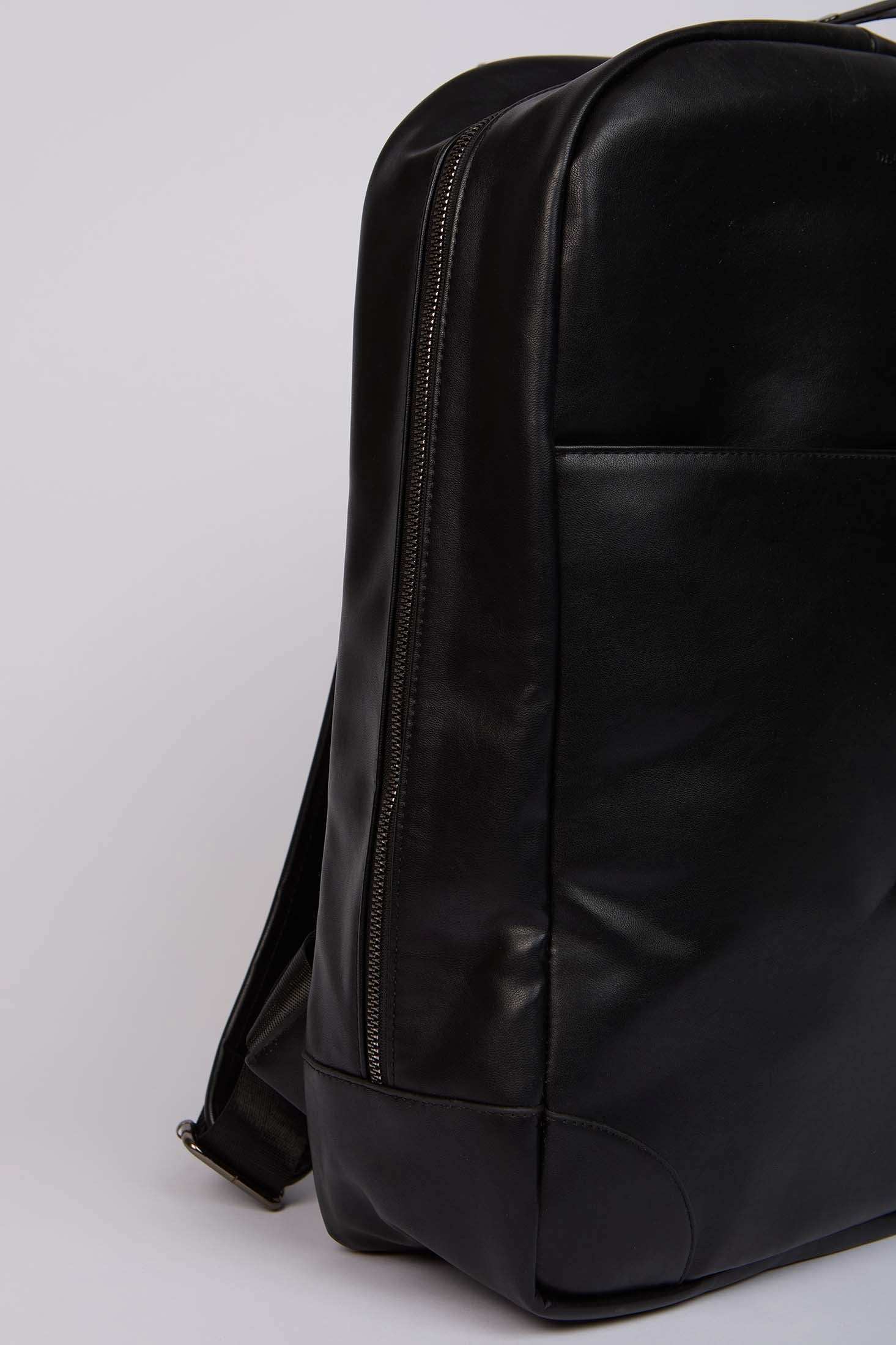 Dalydress black leather backpack with zipper and sleek modern design, close-up view