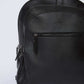 Dalydress black leather backpack with front zipper pocket on plain background