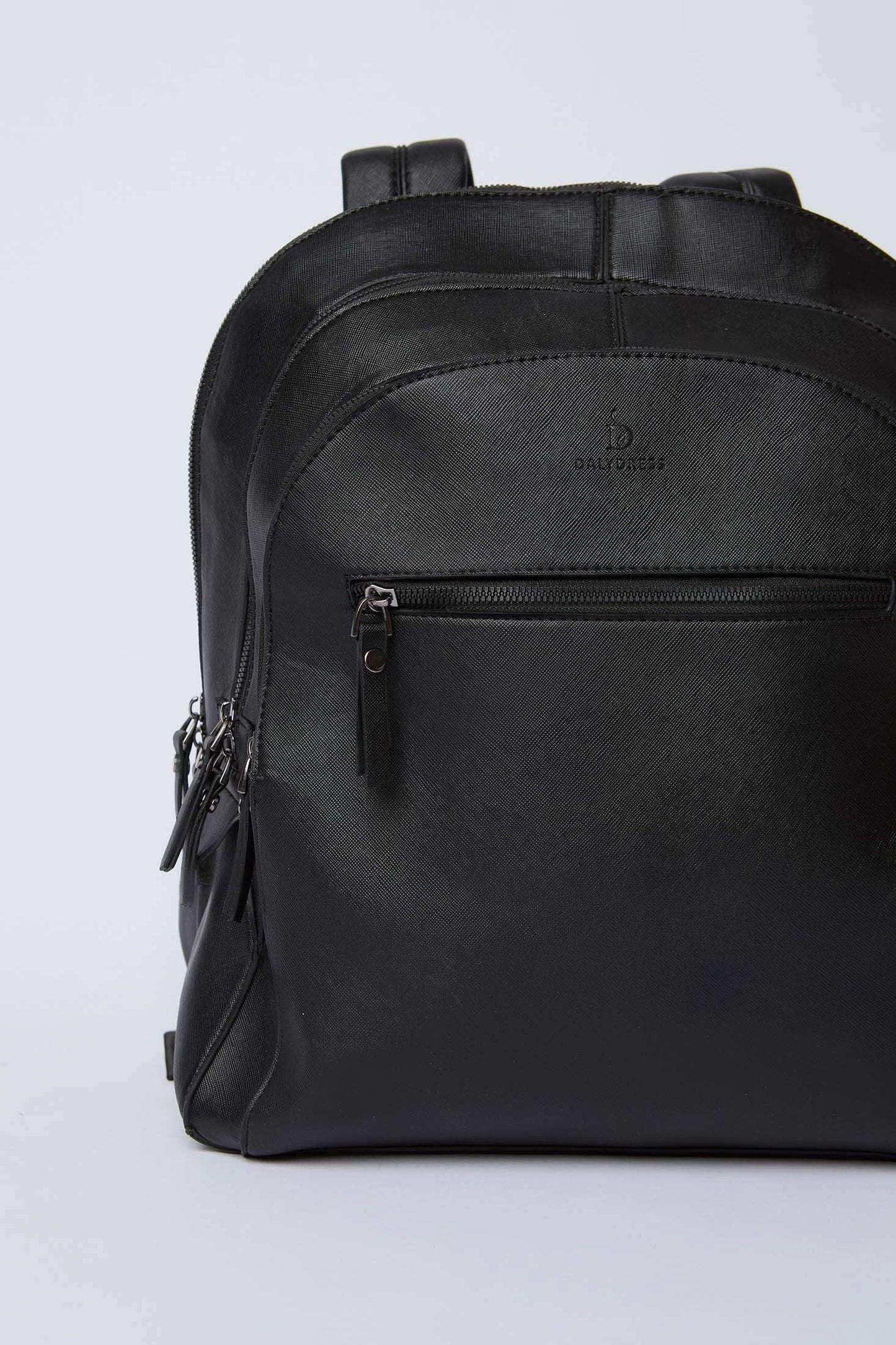 Dalydress black leather backpack with front zipper pocket on plain background