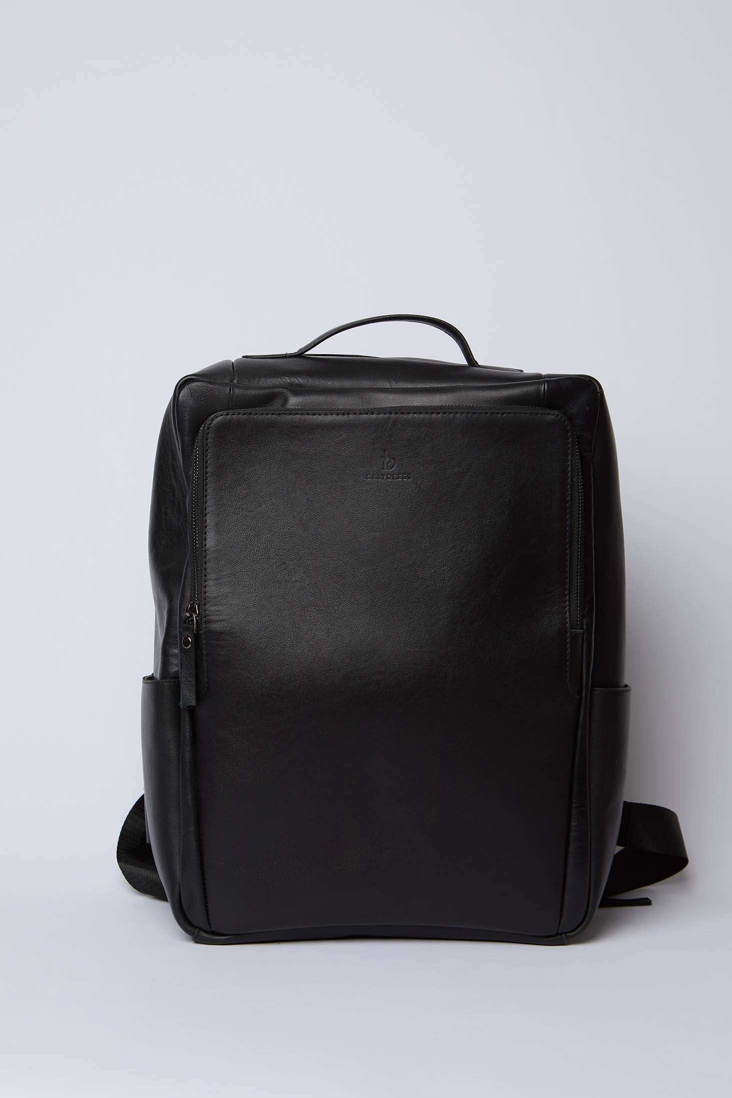 Dalydress black leather backpack with top handle and front zipper pocket on white background