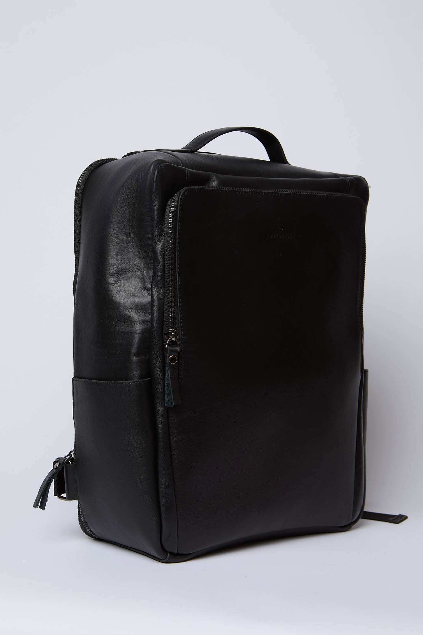 Dalydress black leather backpack with front zipper pocket and handle, minimalist design