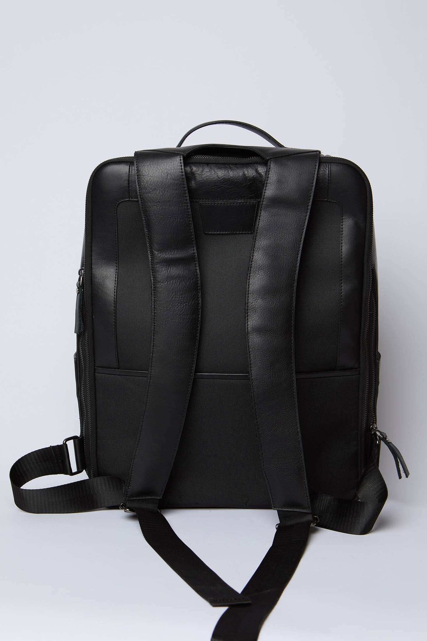 Dalydress black leather backpack with padded straps, modern urban men's accessory