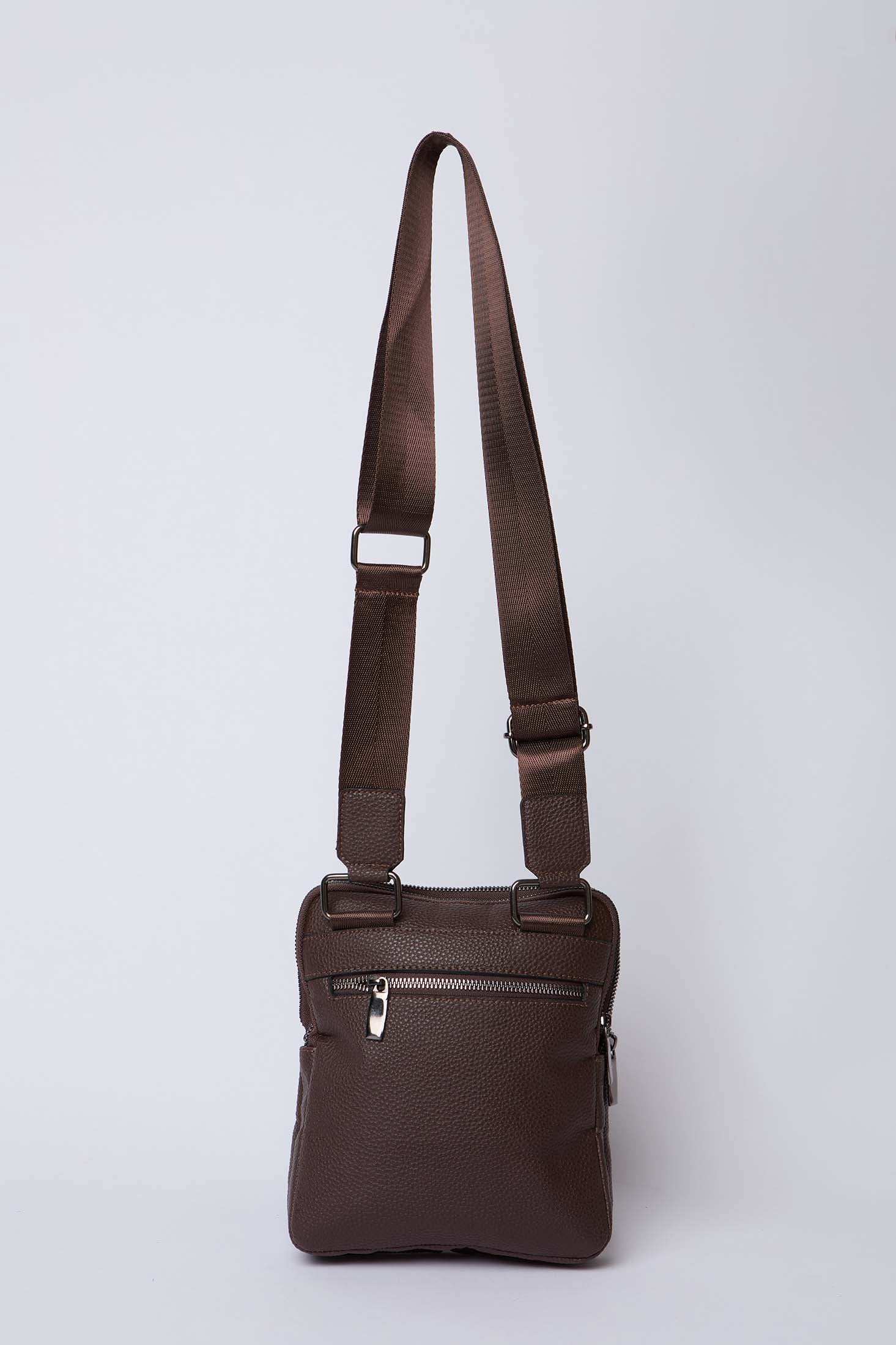 Brown leather crossbody bag with adjustable strap and front zipper pocket