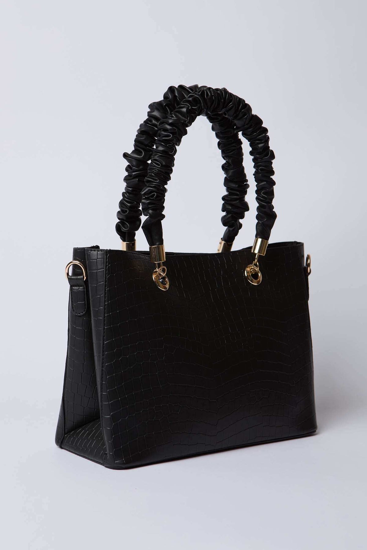Black textured handbag with ruched handles and gold-tone hardware on white background