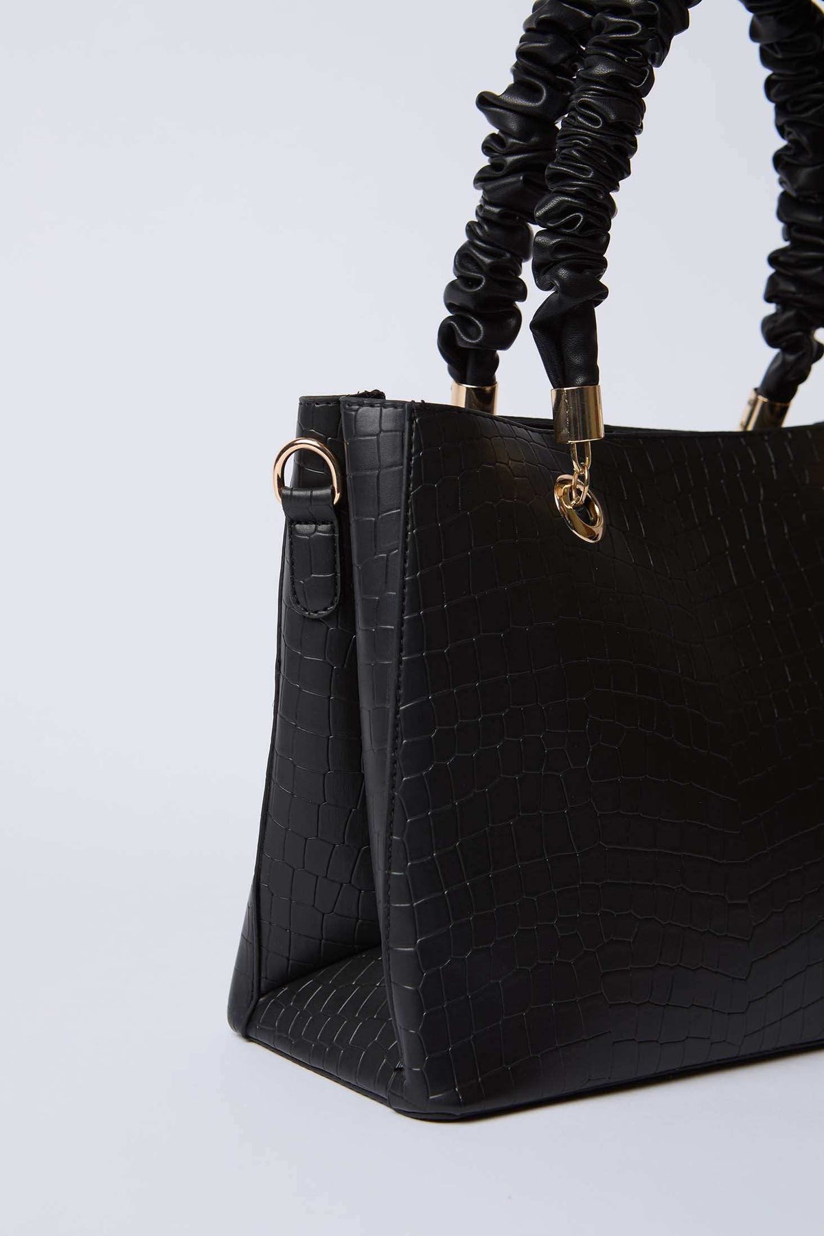 Black faux crocodile leather handbag with ruched top handles and gold hardware