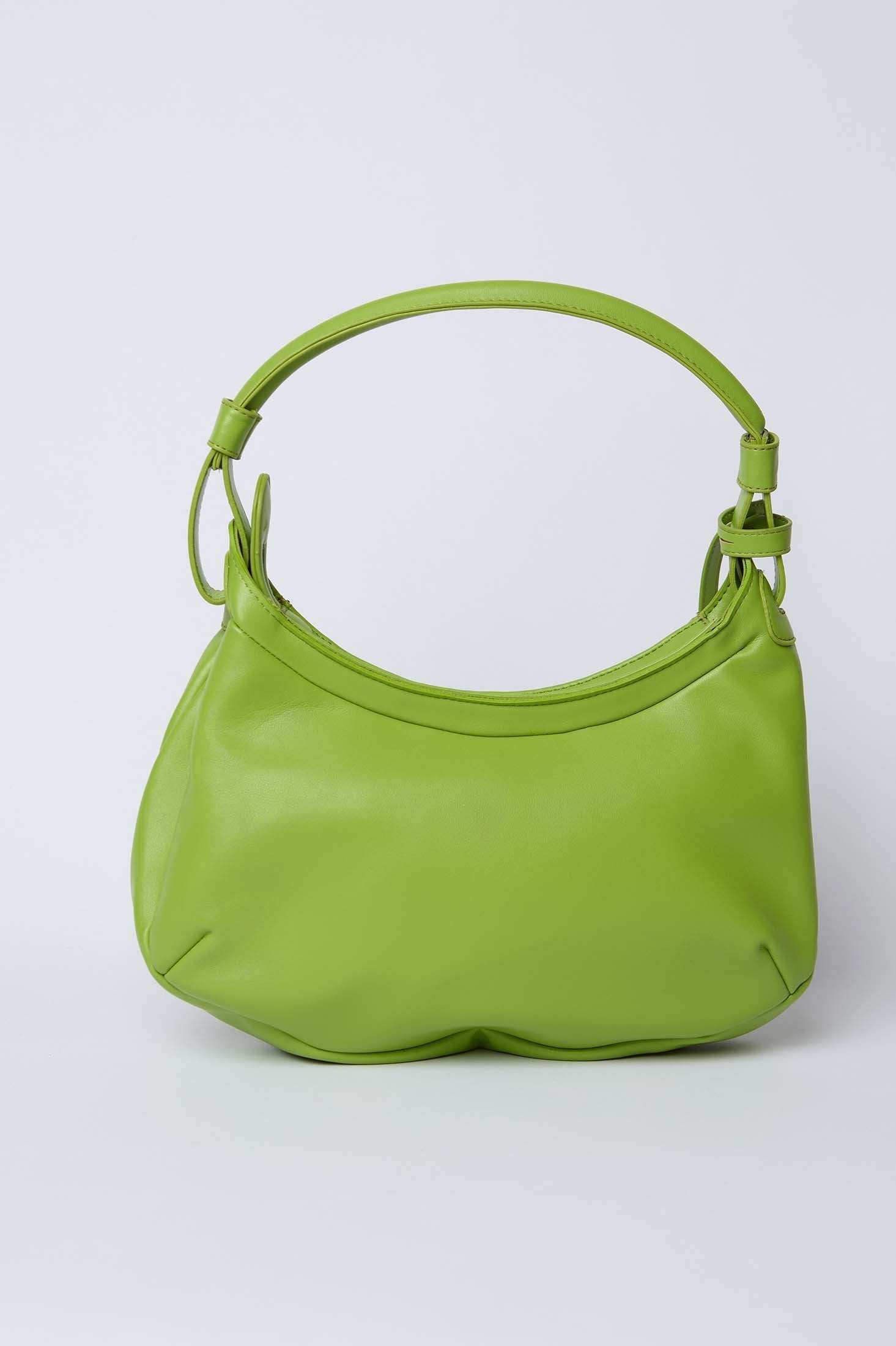 Green leather shoulder bag with single handle on plain background