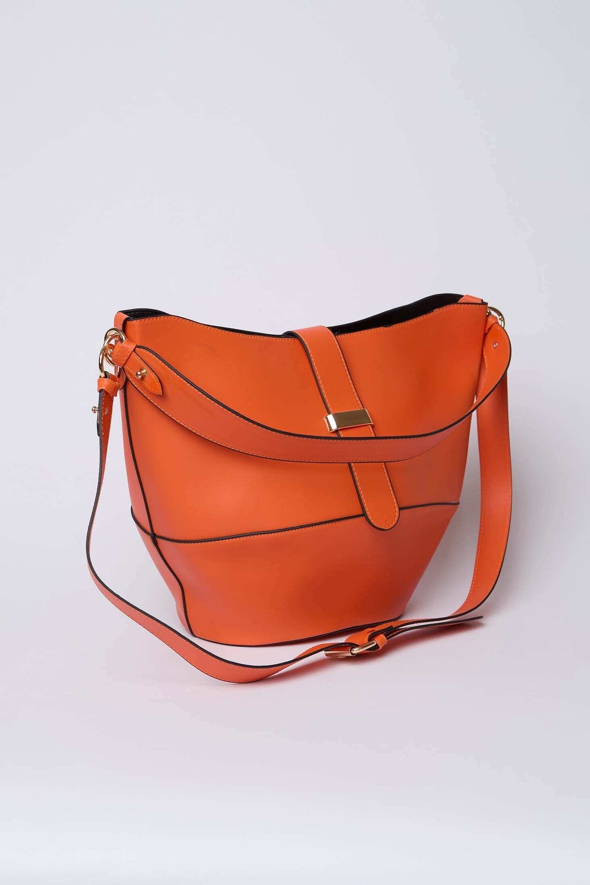 Orange leather shoulder bag with gold-tone hardware and adjustable strap on white background