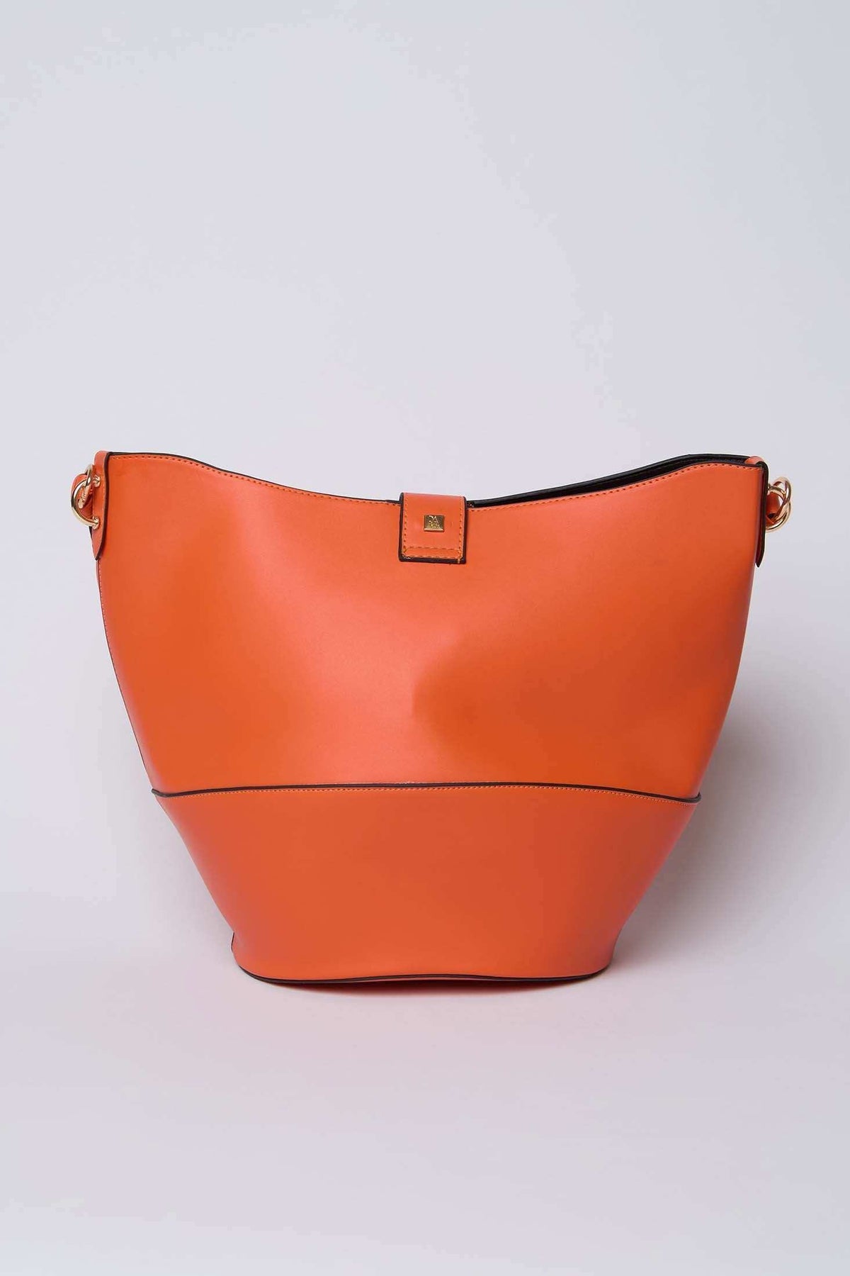Orange leather bucket bag with gold hardware on a plain background