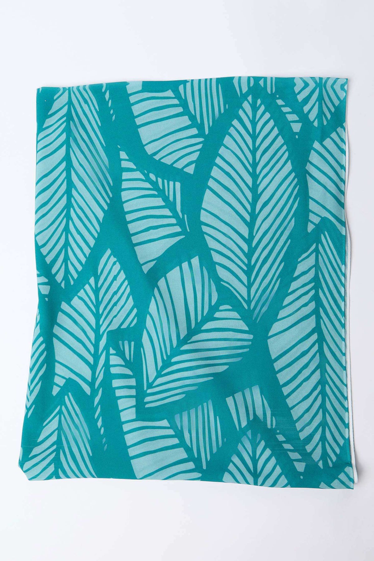 Teal and light blue square scarf with bold leaf print pattern on white background