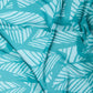 Turquoise fabric with white abstract leaf pattern, lightweight and textured textile