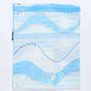 Folded blue and white abstract patterned scarf on white background