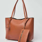 Dalydress brown leather tote bag with matching zippered pouch, minimalist background