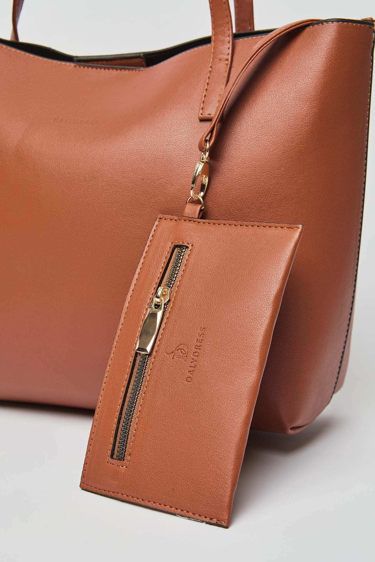 Dalydress brown leather tote bag with matching zip pouch, gold hardware, Egypt fashion brand