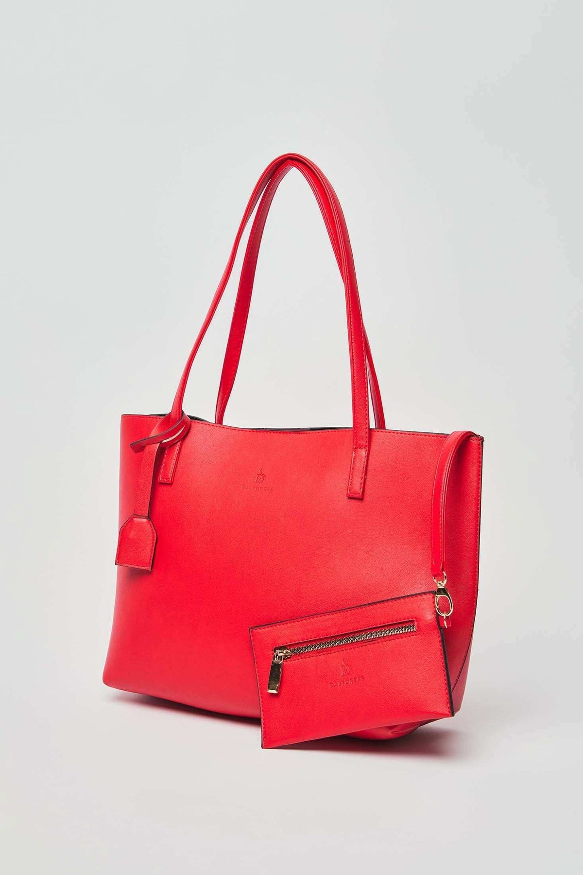 Dalydress red tote bag with matching zip pouch, stylish women's accessory on light background