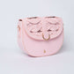 Dalydress pastel pink women's crossbody bag with woven flap and gold hardware on white background