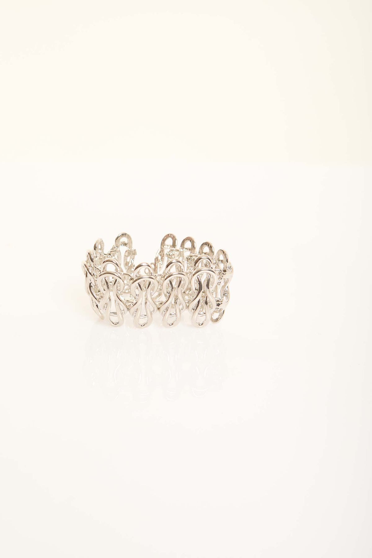 Elegant Sculpted Metal Bangle with Linked Pattern