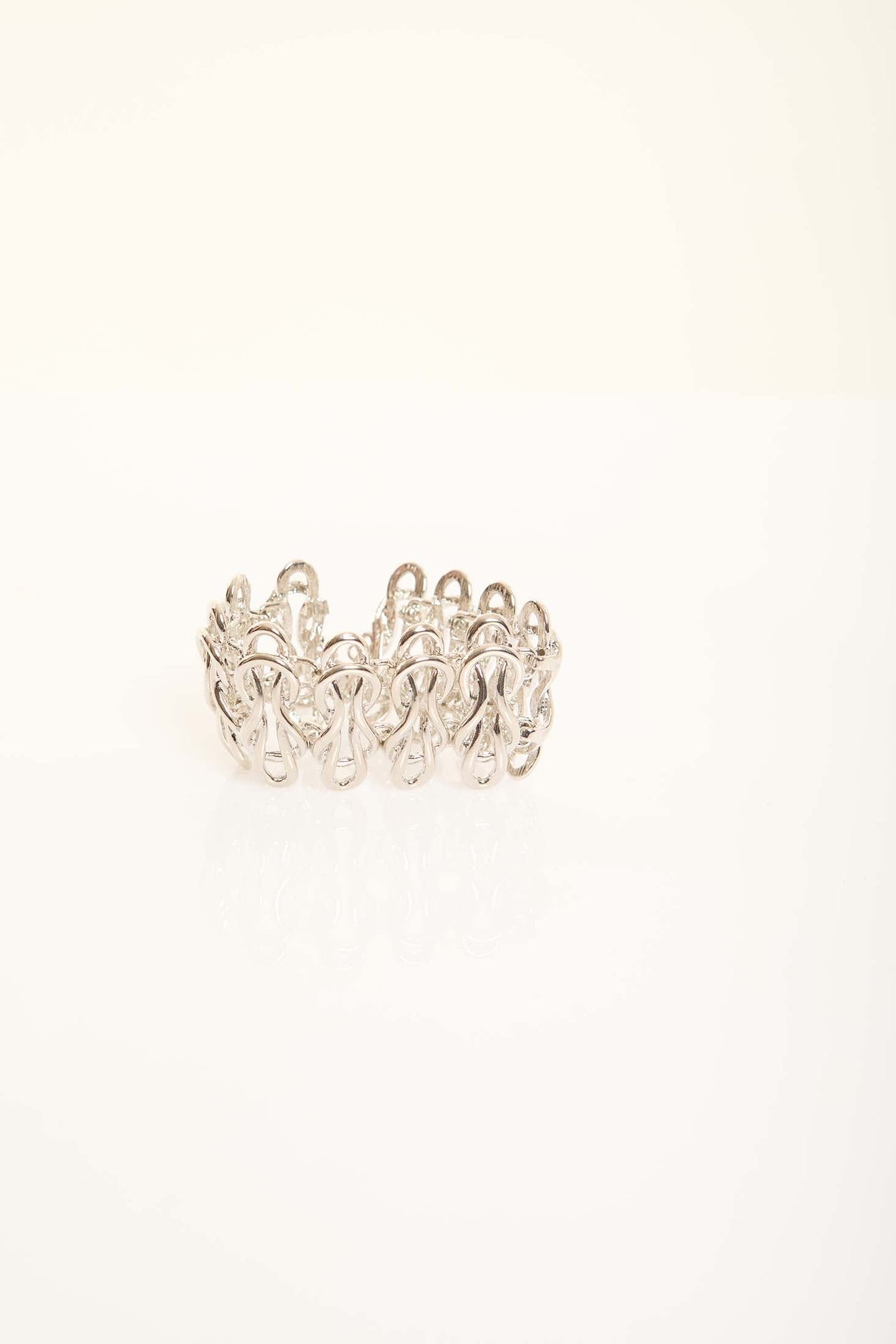 Elegant Sculpted Metal Bangle with Linked Pattern