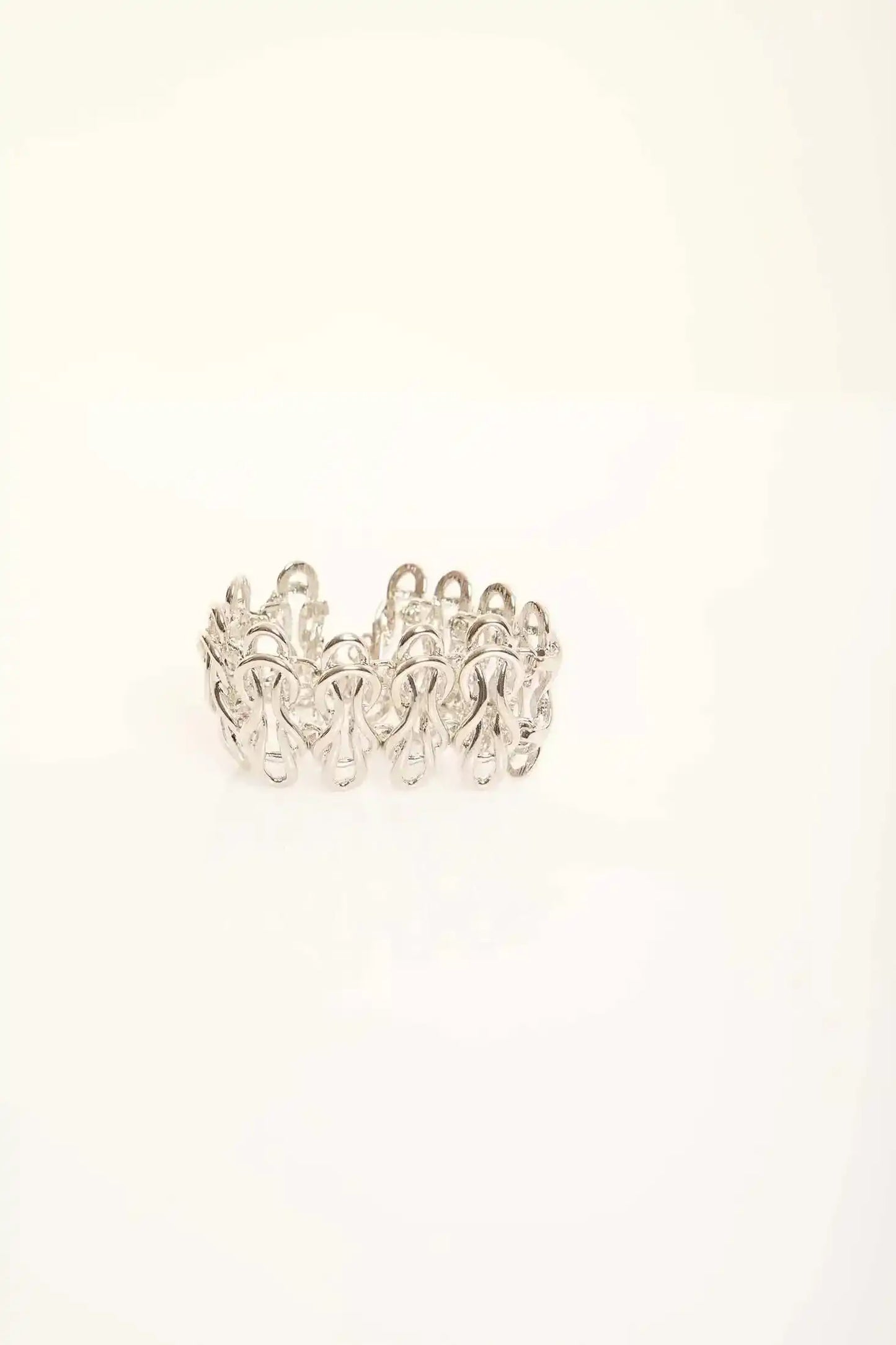 Elegant Sculpted Metal Bangle with Linked Pattern