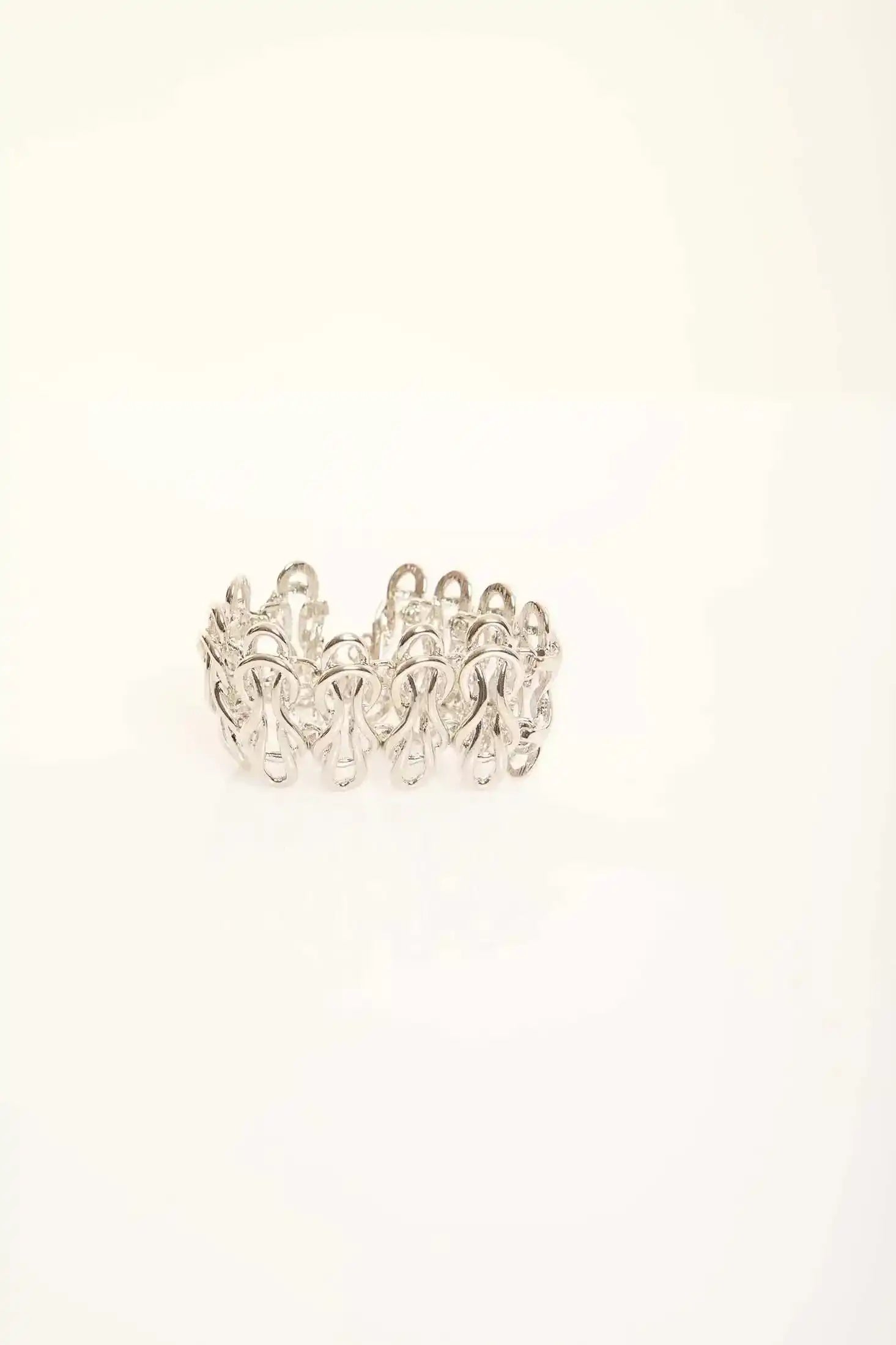 Elegant Sculpted Metal Bangle with Linked Pattern