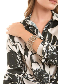 Elegant Sculpted Metal Bangle with Linked Pattern