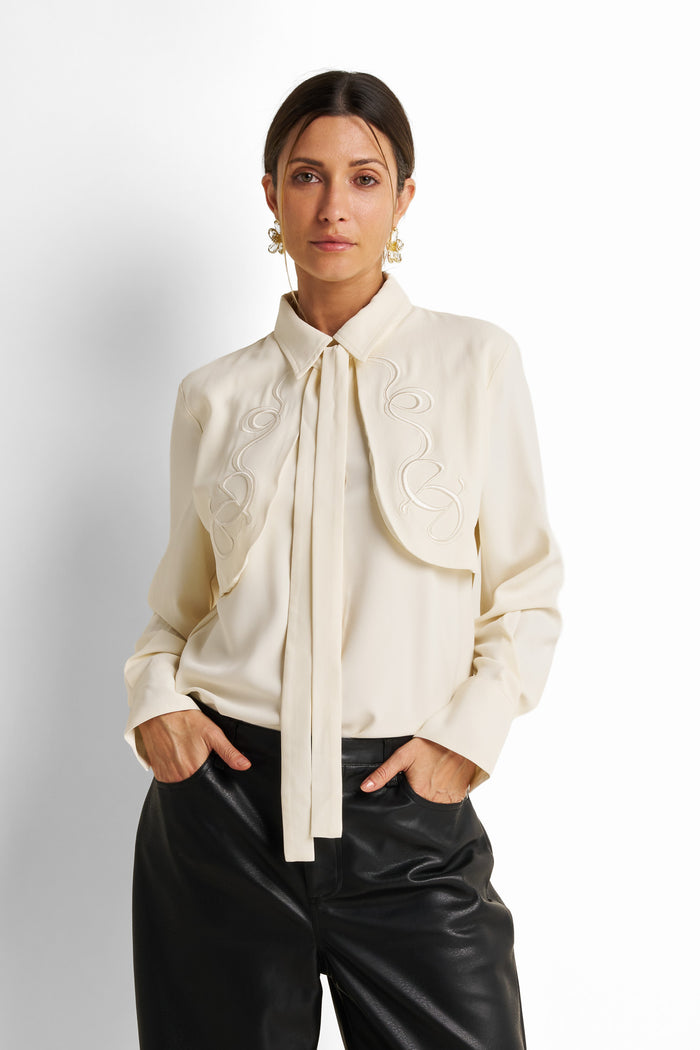 Embroidered yoke tie-neck blouse