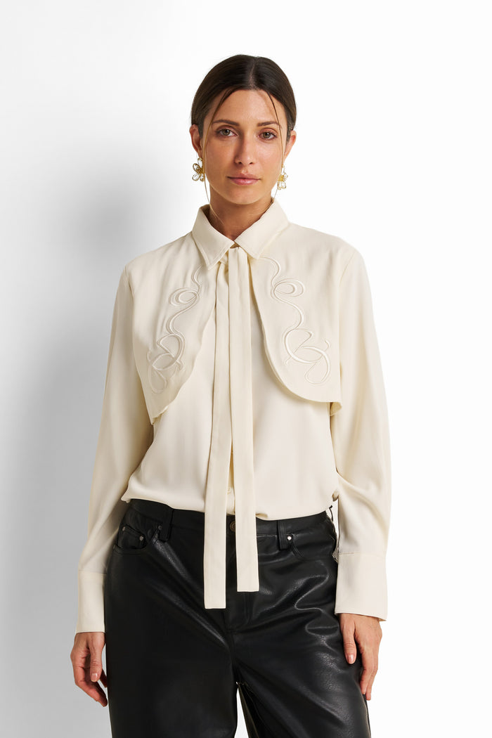 Embroidered yoke tie-neck blouse